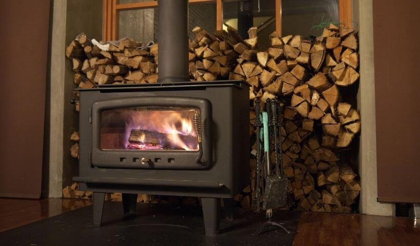 Wood stove with stack of firewood
