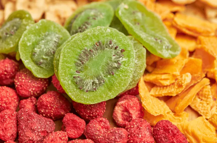 A pile of dehydrated strawberries, kiwis, and mangoes.